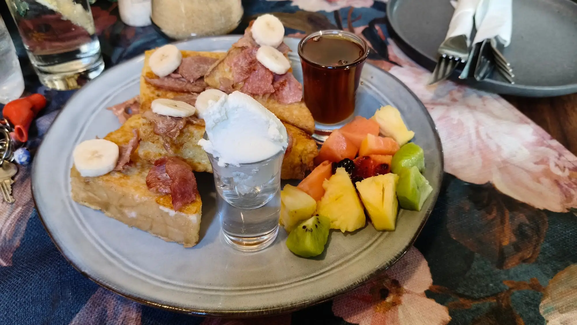 French toast with fruit, cream and berry compote