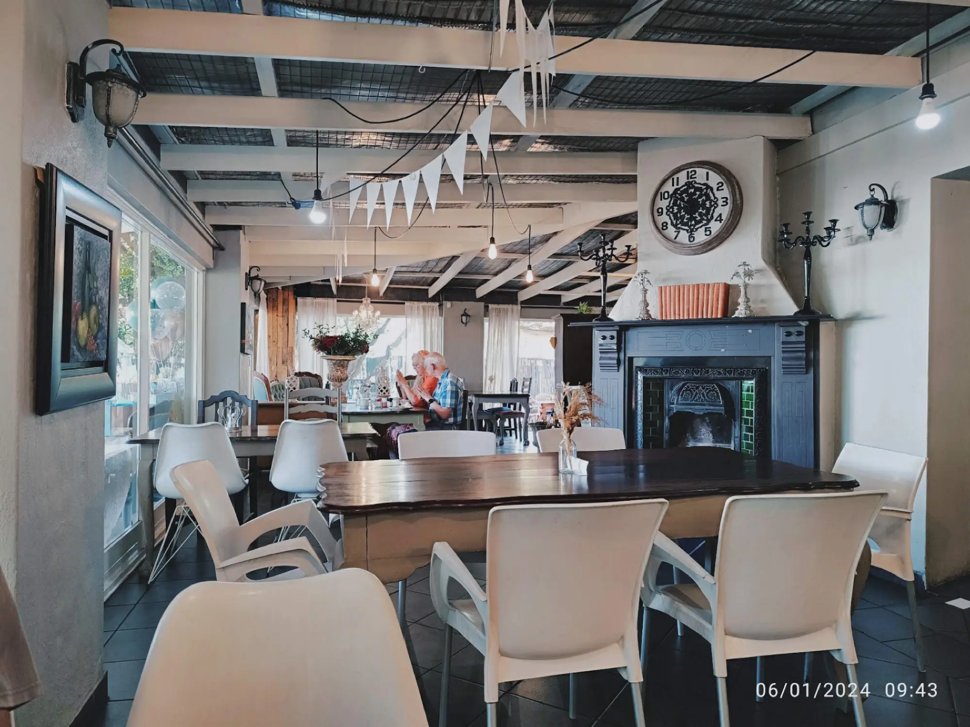 Inside: tables by the cast-iron fireplace
